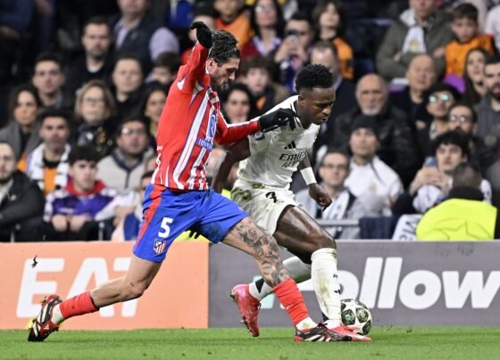 Foto colorida de Rodri De Paul, do Atlético de Madrid, e Vini Jr, do Real Madrid - Metrópoles