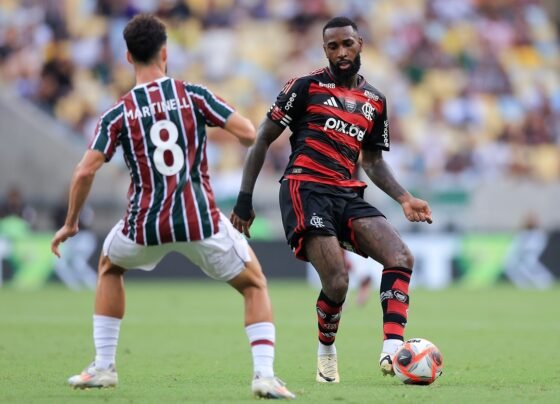 Foto colorida de Gerson e Martinelli, de Flamengo e Fluminense, respectivamente