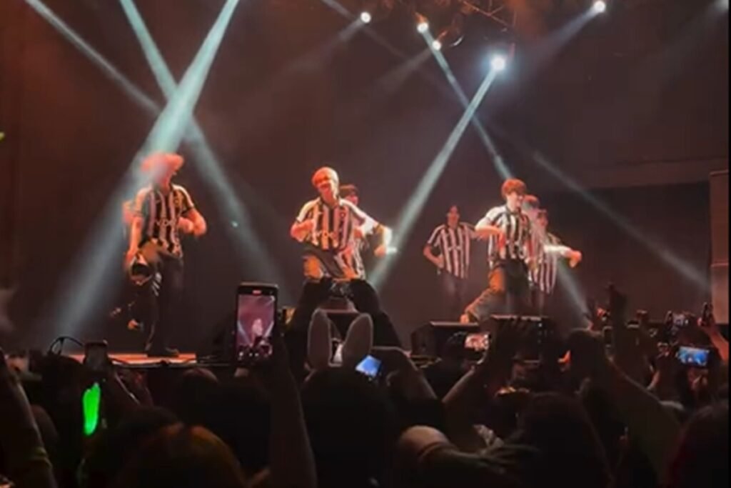 Print de um vídeo colorido da banda NTX - Metrópoles