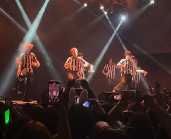Print de um vídeo colorido da banda NTX - Metrópoles